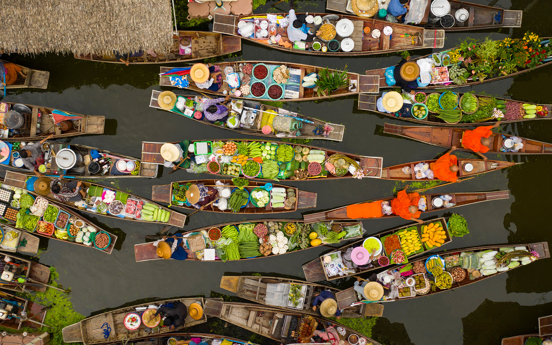 A birds eye view of boats carrying goods in Bangkok.