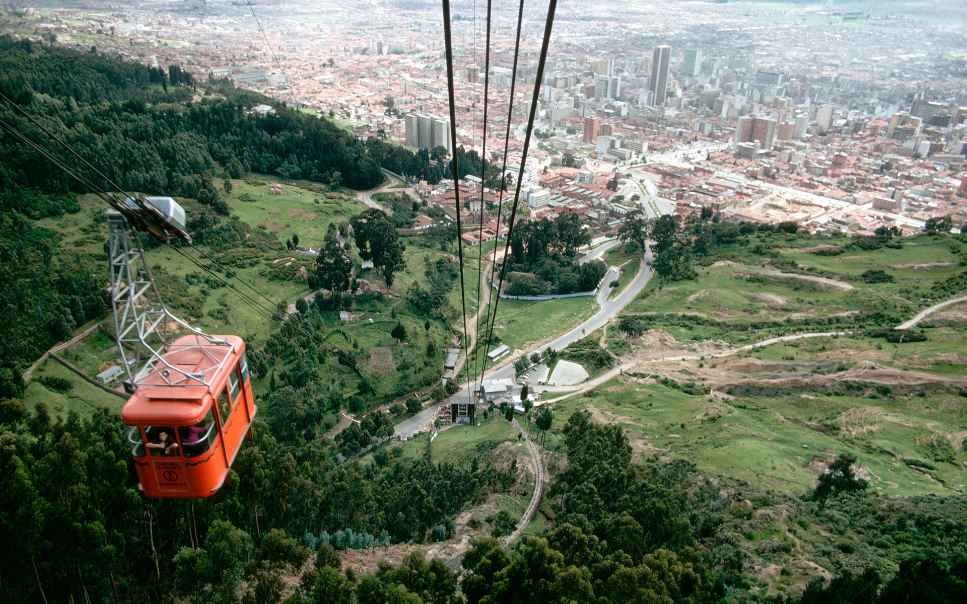 A cable car descends from the mountains to Bogotá