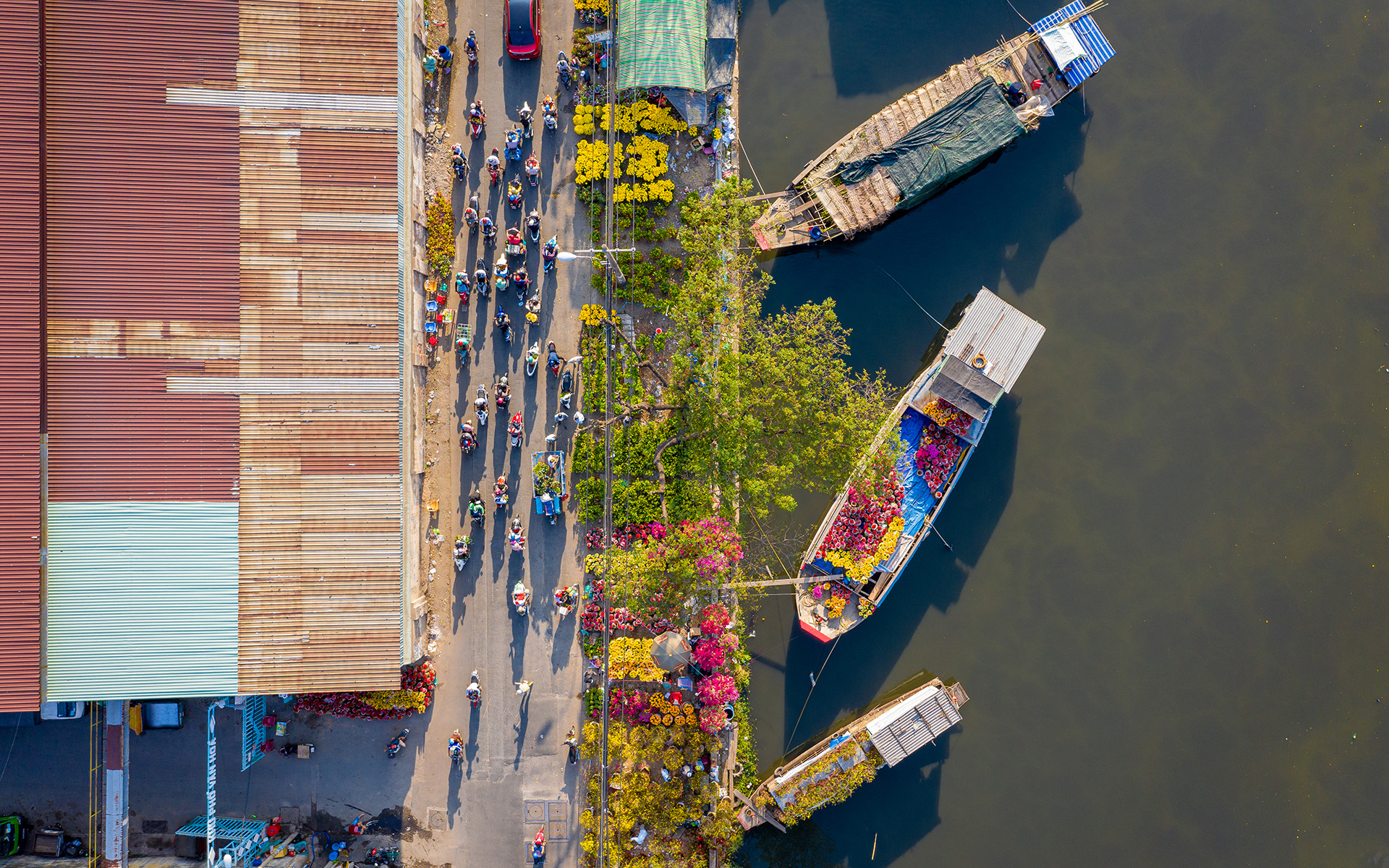 A bird's eye view of boats and waterfront walkway in Ho Chi Minh.