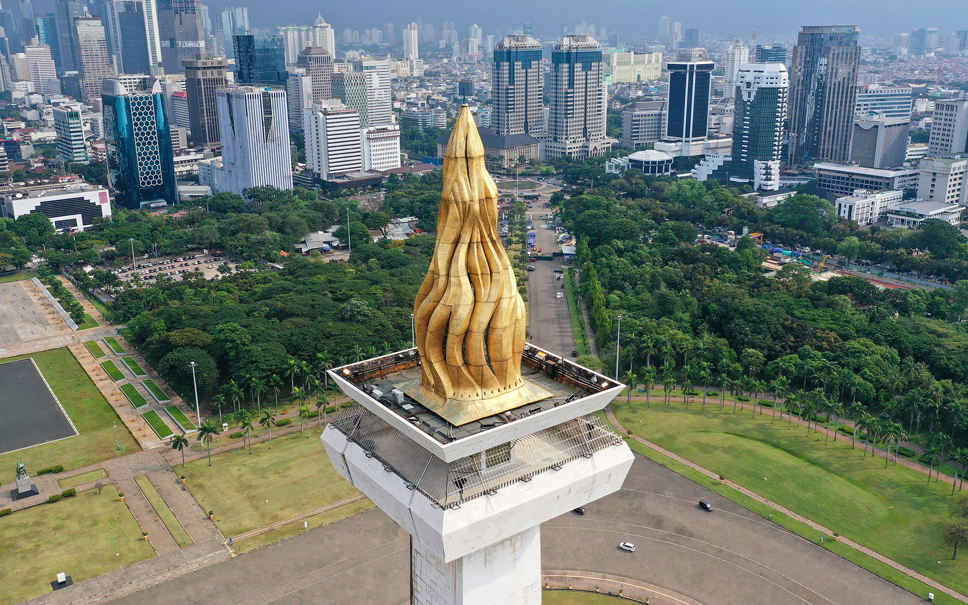 Jakarta's National Monument overlooking the city's downtown area.