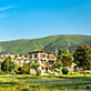 Homes and business spaces in Bursa against a mountain backdrop.