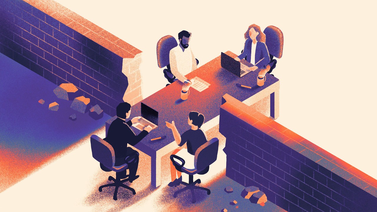 Illustration of workers sitting at a table which is breaking through a wall